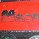 MELODY - Letrero grabado y biselado en gravoply en bajo relieve a base de pantógrafo.